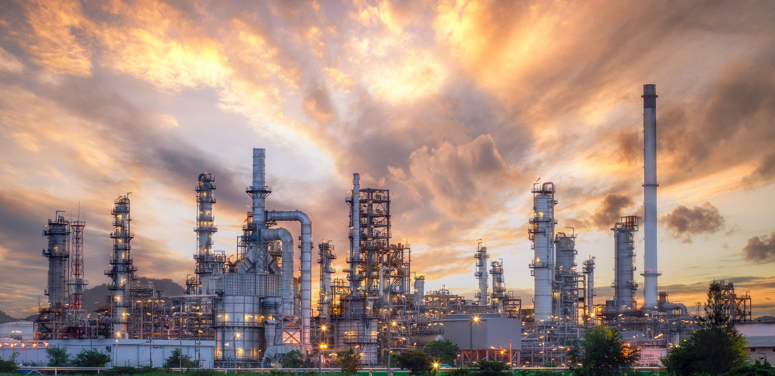 Oil refinery at sunset